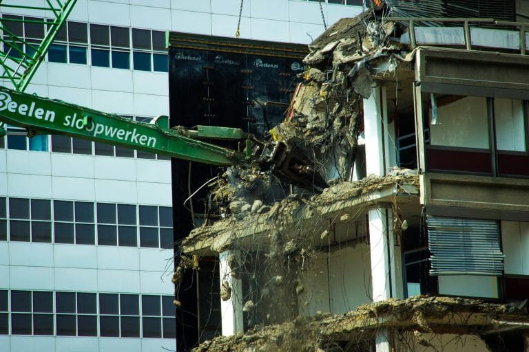 Commercial building being demolished, like retail bay and office suite teardowns along Bay Area Boulevard