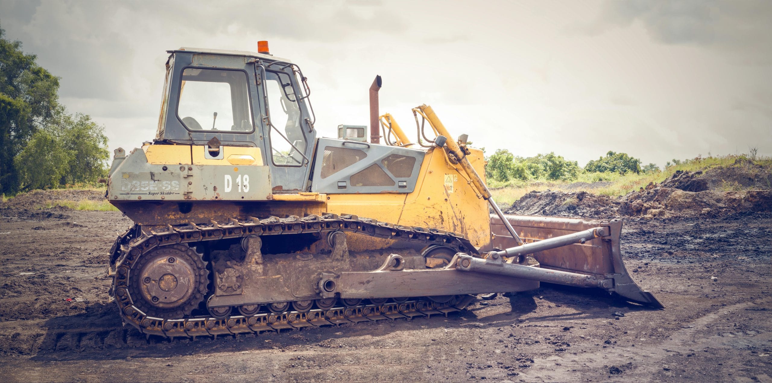 Bulldozer on a construction site, showcasing heavy machinery used for excavation and land clearing in Houston, TX.