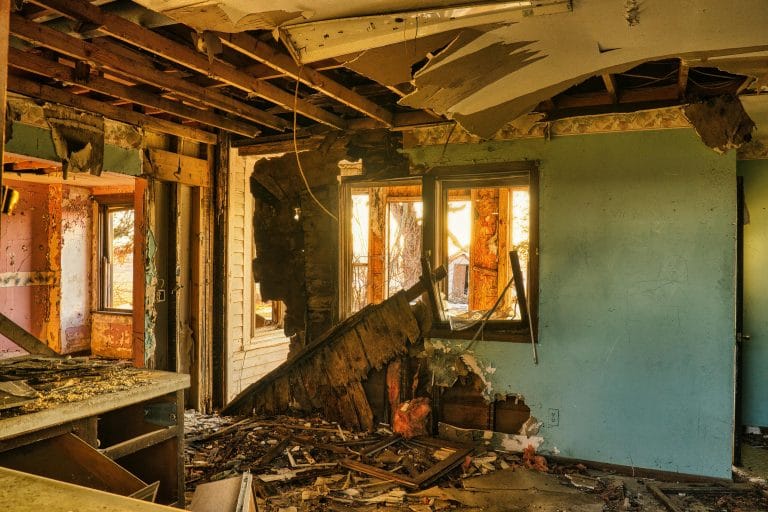 Gutted interior with walls and ceiling stripped for an interior demolition remodel in Clear Lake